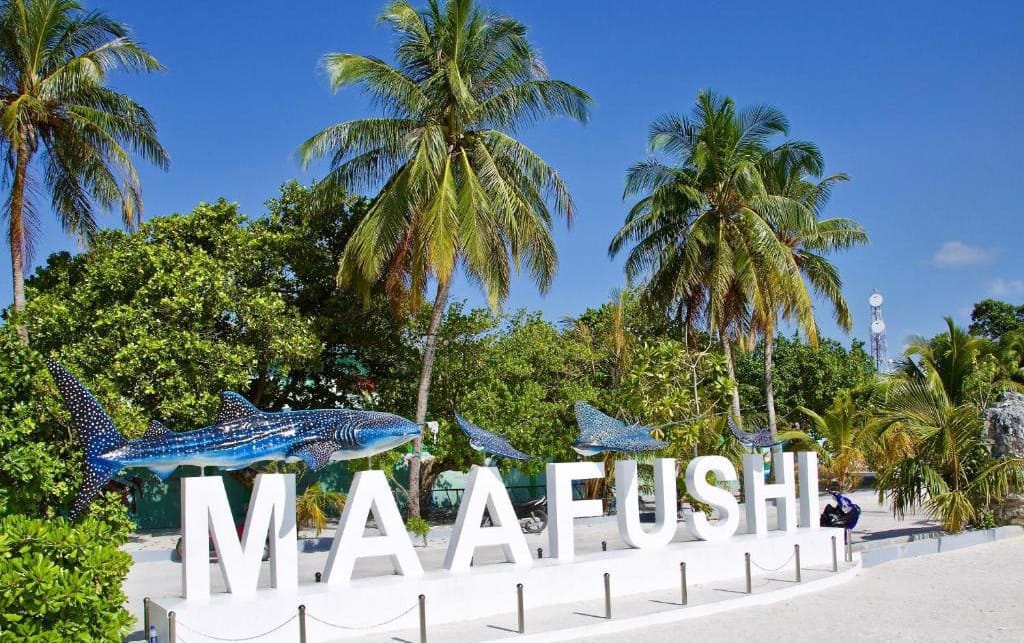 Maafushi welcome sign with whale shark sculpture, Maldives